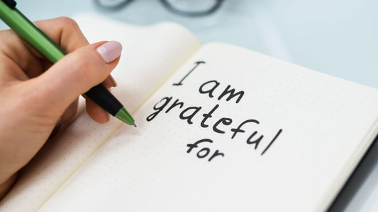 Gratitude journal open to a page with the words, "I am grateful for"